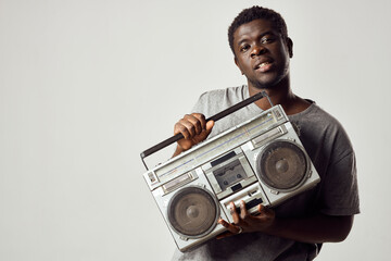 man with a tape recorder in his hands listening to music african appearance lifestyle