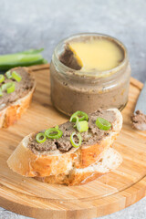 Homemade chicken liver pate served on fresh, crunchy bread slices