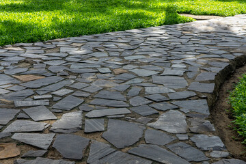 Garden footpath made of grey pavestone - 454931978
