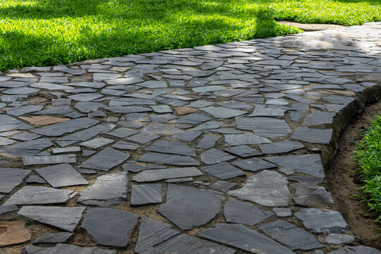 Garden footpath made of grey pavestone