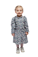 Smiling little girl 3 years old in a dress. Love and tenderness. Full height. Isolated on white background. Vertical.