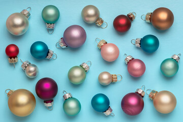 Christmas or New Year Festive pastel Christmas balls over blue background