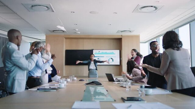 funny business woman celebrating in boardroom successful corporate victory colleagues throwing papers excited applause in office meeting enjoying winning success 4k