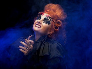 Halloween Vampire Woman portrait. Beautiful Glamour Fashion Sexy Vampire Lady with red hair.