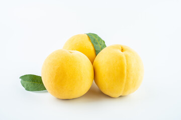 Yellow peach on white background