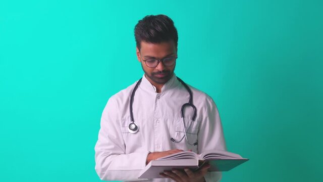 pakistanian doctor in white coat with stethoscope feeling confident mock up over blue studio background