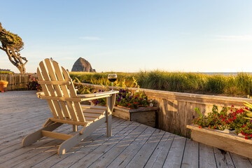 Ocean view with a glass of wine on a deck chair on a sunny day