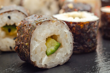 Closeup of  cucumber and wasabi hosomaki roll, traditional Japanese food