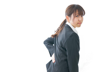 腰痛を感じるビジネスウーマン