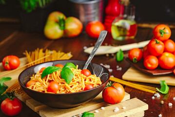 Spaghetti with meat, tomatoes and basilium