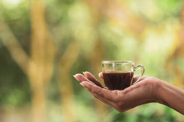 coffee cup in hand in the morning