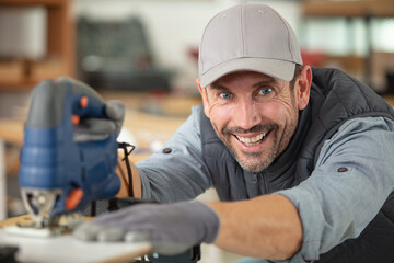 portrait of professional male carpenter in workshop