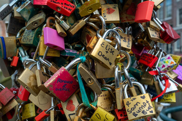Love locks hang on the Staalbrug over the Groenburgwal in Amsterdam, Noord-Holland Province, The Netherlands