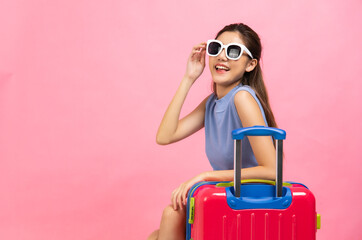 Tourist young woman in summer casual clothes.Asian Smiling woman .Passenger traveling abroad to travel on pink color background.Asian woman going to summer vacation.Travel trip funny.