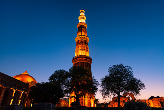 Silhouette of Qutub Minar a highest minaret in India standing 73 m tall tapering tower of five storeys made of red sandstone. It is UNESCO world heritage site at  New Delhi,India