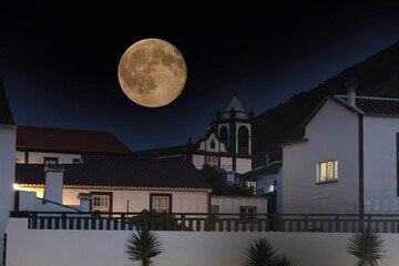 The moon rises on the sky of the square of Santa Cruz, Graciosa island, Azores