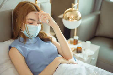 Sick Woman.Flu.Woman Caught Cold. Sneezing into Tissue. Headache. Virus .Medicines. Young Woman Infected With Cold Blowing Her Nose In Handkerchief.