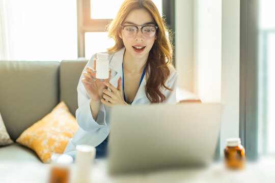 Woman doctor visit,telemedicine healthcare concept,young female doctor giving advice over laptop computer .she using laptop to get medical consultation online and explane .