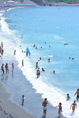 Group of people walking on beach and get funny