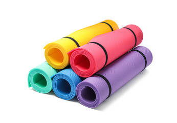 Colorful rolled camping or exercise mats on white background