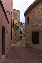 street of the old mediterranean town of begur on the costa brava with old historical buildings