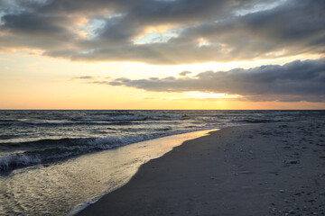 Picturesque view of beautiful sky with clouds over tropical beach at sunset