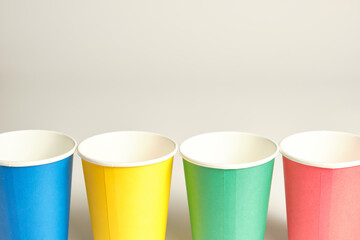 colored cardboard cups placed in line