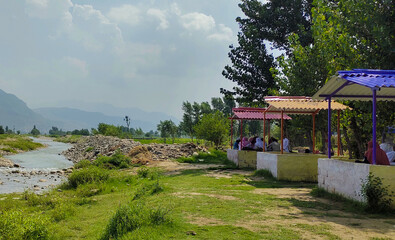 beautiful swat valley Pakistan mountains with green trees and grass water stream,natural landscape