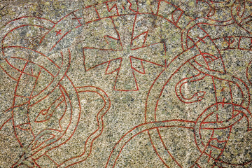 Fototapeta na wymiar Close up view of runestone with inscription from the 1000s AD. Sweden. 