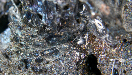 Frozen lava in the studio in front of black background photographed in Marco mode 