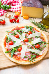 pizza focaccia with tomatoes, cheese and rucola