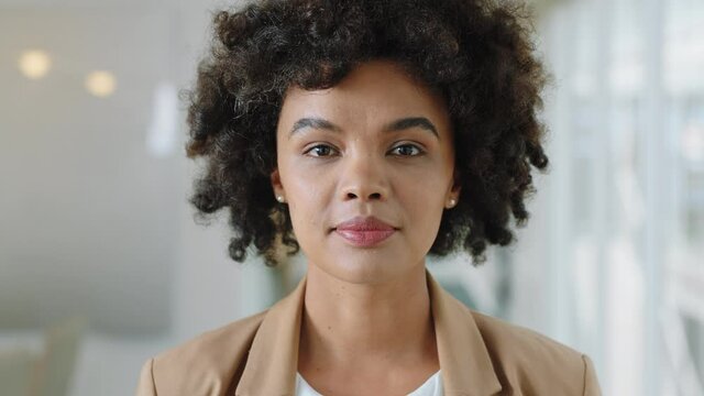 portrait happy business woman with afro smiling enjoying successful career proud entrepreneur in office workplace testimonial 4k footage