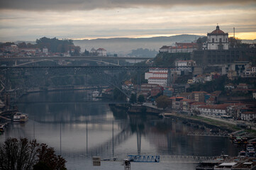 Panoramic view on Douro river and old part of Porto city in Portugal at cloudy sunrise