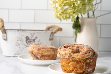 Homemade pastry on white counter against white background 