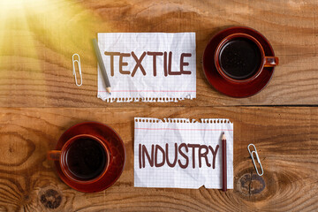 Text sign showing Textile Industry. Internet Concept production and distribution of yarn cloth and clothing Display of Different Color Sticker Notes Arranged On flatlay Lay Background