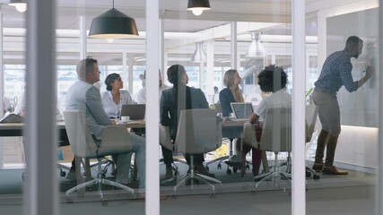 group of business people meeting in boardroom team leader man presenting ideas on whiteboard discussing strategy with colleagues in office training presentation 4k - Powered by Adobe