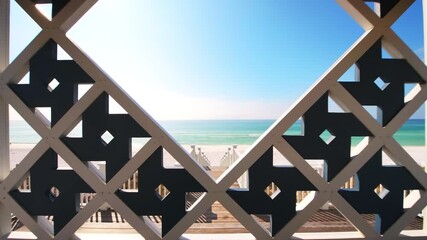 Point of view pov handheld walking shot of geometric modern pavilion gazebo by beach sea ocean of Gulf of Mexico at Seaside, Florida with new urbanism architecture on sunny day - Powered by Adobe