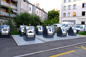 GENEVA, Switzerland - August 2021: metal waste containers for separate sorting public waste in...
