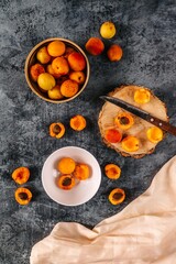 Apricots on gray background with copy space. Top view. Flatlay