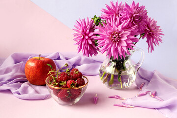 Obraz na płótnie Canvas The concept of a good autumn morning.A bouquet of pastel dahlias, a cup with ripe raspberries, a red apple on a light scarf, a pastel background, a side view, a place for text