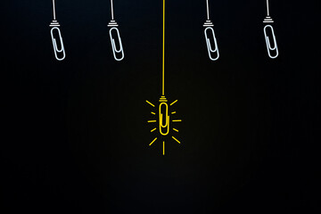 Fototapeta na wymiar Paperclip idea Success concept Great Creative Ideas. Glowing light bulb (paperclip) on black clear background 