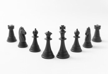 Set of black chess pieces. Photograph isolated on white background