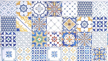 typical sicilian floor and wall tiles in different patterns and design in blue, yellow and white color - obrazy, fototapety, plakaty
