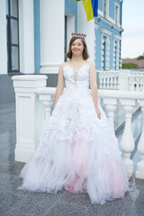 Girl with Down syndrome in  wedding dress.