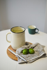 Enamel jar with water and lime 