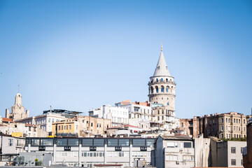 Galata tower, one of the historical towers of Istanbul. It is one of the most important places in Istanbul. Galata tower and historical buildings. Selective focus.