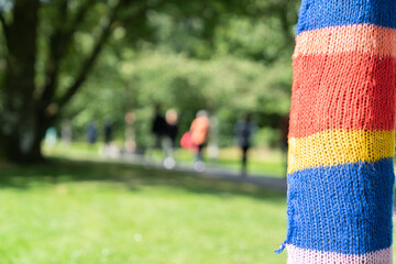 Color and interested added by yarn bombing trees in parks