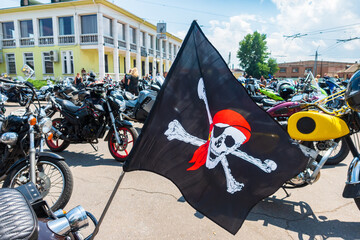 Pirate flag on a motorcycle. Biker convention