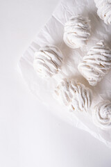 Fototapeta na wymiar airy marshmallow on white parchment