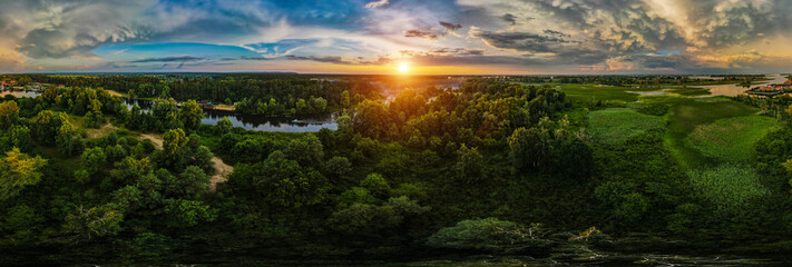 Landscape from above. Trees and river at sunset. Drone photo